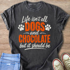 Charcoal t-shirt with white and orange text: Life isn't all DOGS and CHOCOLATE but it should be.