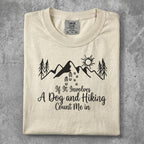 Cream t-shirt with "If It Involves A Dog and Hiking Count Me In" and mountain graphic.