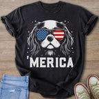 Black t-shirt with white dog wearing American flag sunglasses and text "'MERICA."