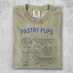 T-shirt with "Pastry Pups" text and illustrations of dogs as pastries.