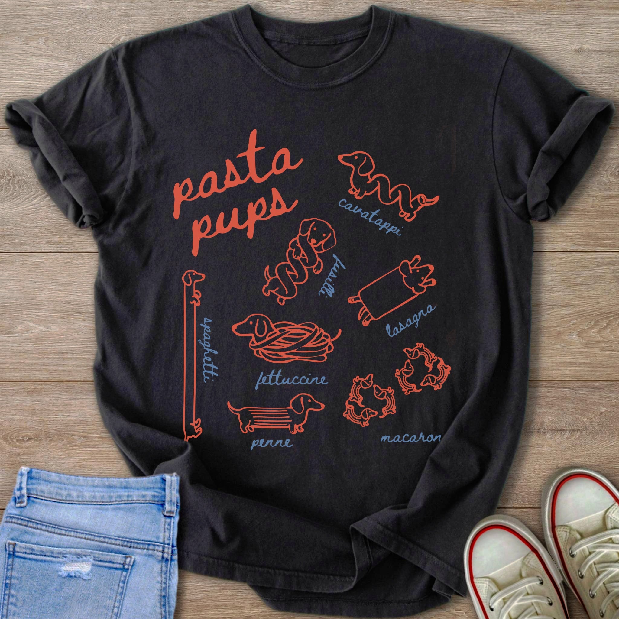 Dark t-shirt with red dachshunds illustrated as various pasta shapes and names.