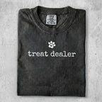 Gray t-shirt with "treat dealer" and a paw print logo.
