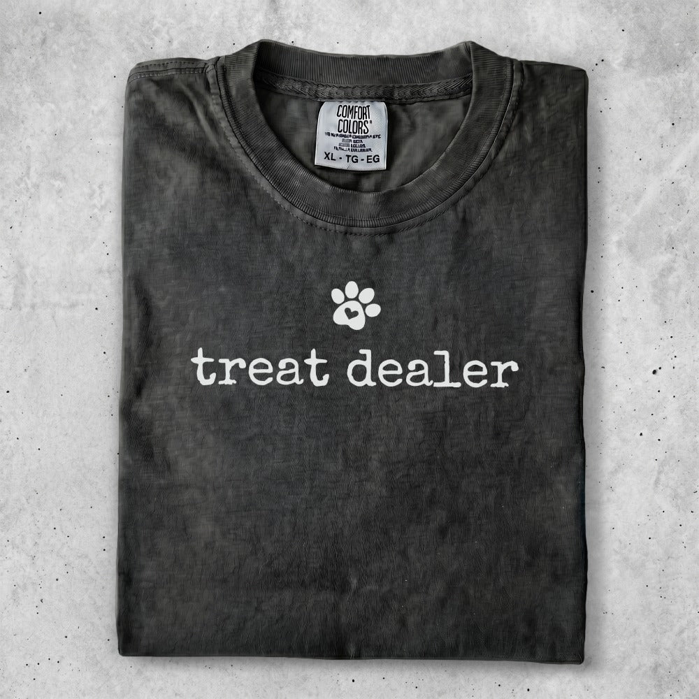 Gray t-shirt with "treat dealer" and a paw print logo.