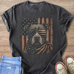 T-shirt graphic of a pitbull wearing sunglasses and a bandana with an American flag design.