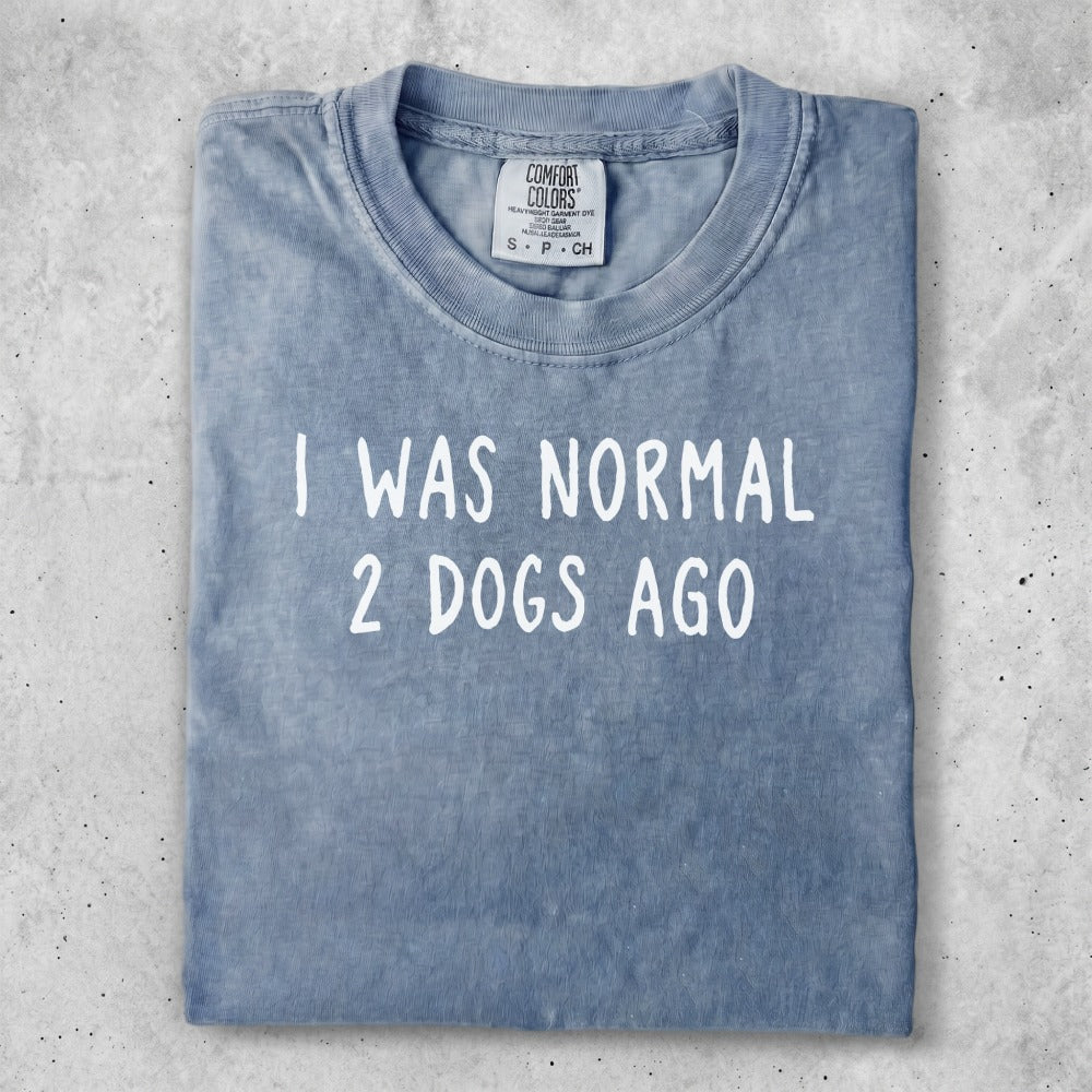 Blue t-shirt with text "I WAS NORMAL 2 DOGS AGO".