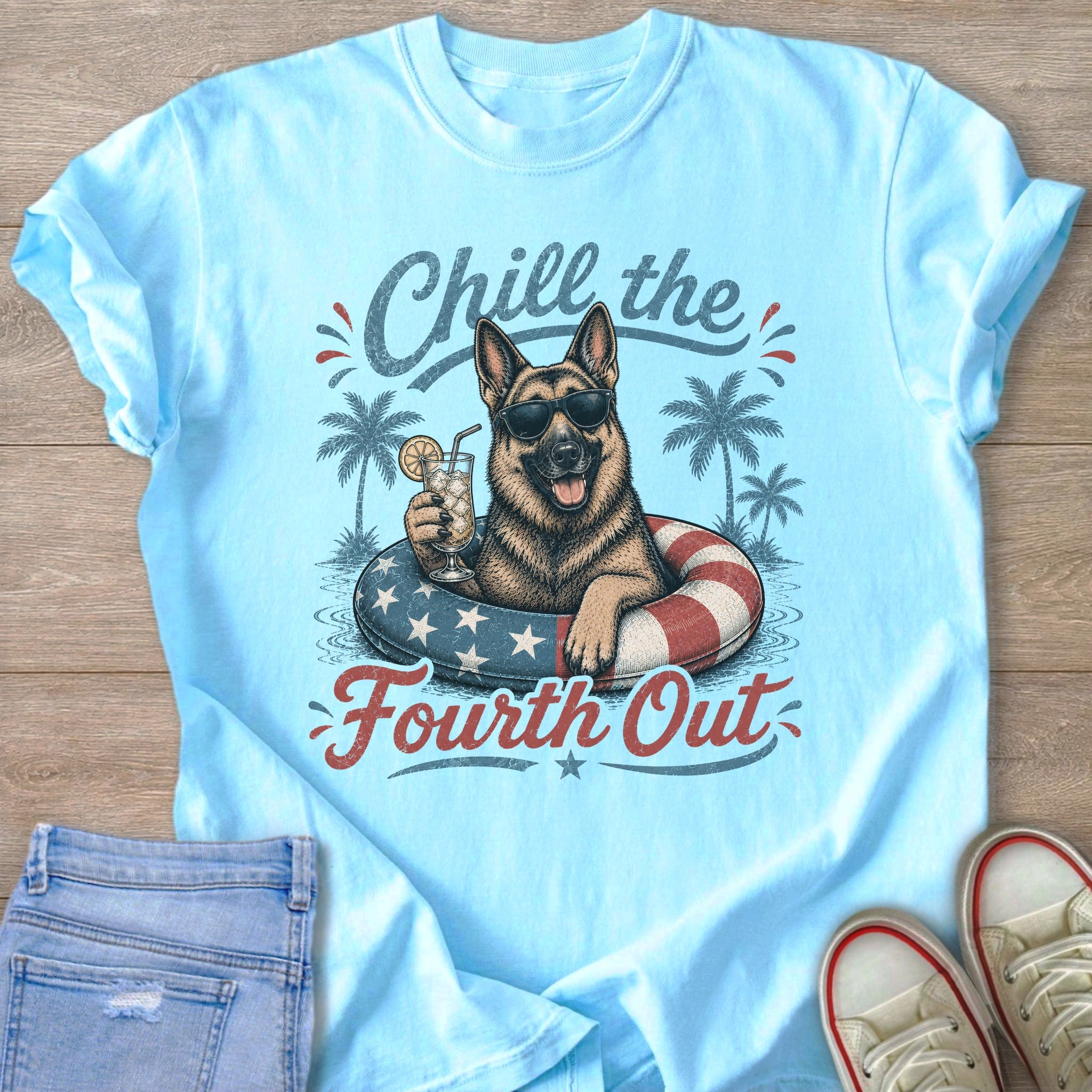 German Shepherd wearing sunglasses drinks a cocktail in a patriotic float, text "Chill the Fourth Out."
