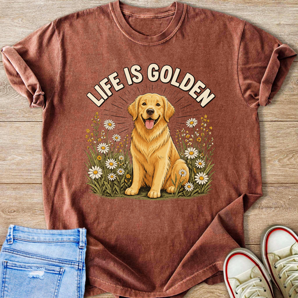 Golden retriever sits in a field of daisies with text "LIFE IS GOLDEN" above.