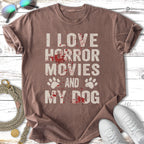 T-shirt with "I love horror movies and my dog" text and paw prints.