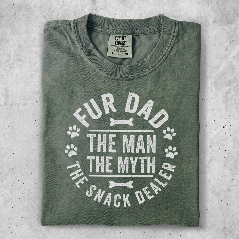 Green t-shirt with "Fur Dad The Man The Myth The Snack Dealer" text.