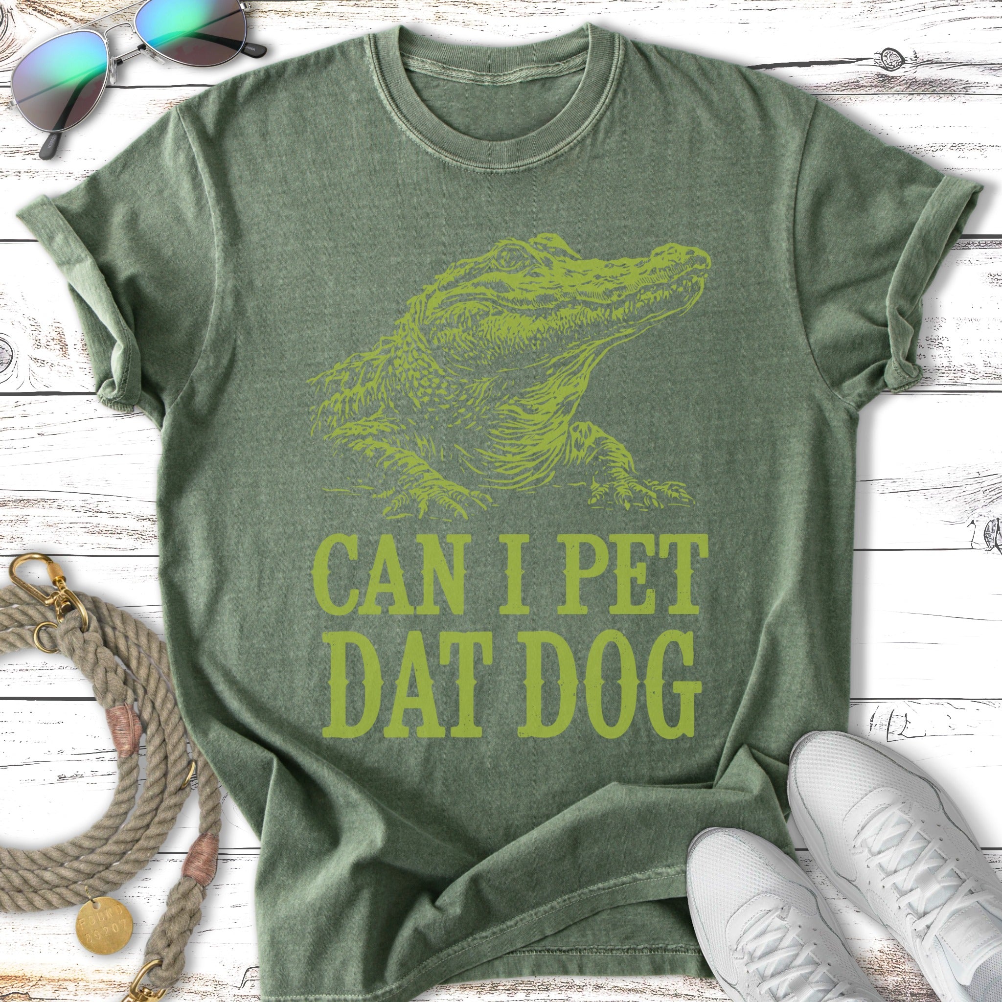 Green t-shirt with alligator graphic and "Can I pet dat dog" text.