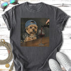 Yorkshire terrier in a baseball cap being poured red wine into a glass.