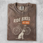 T-shirt with "Ride Bikes Pet Dogs" text and a bicycle and dog graphic.