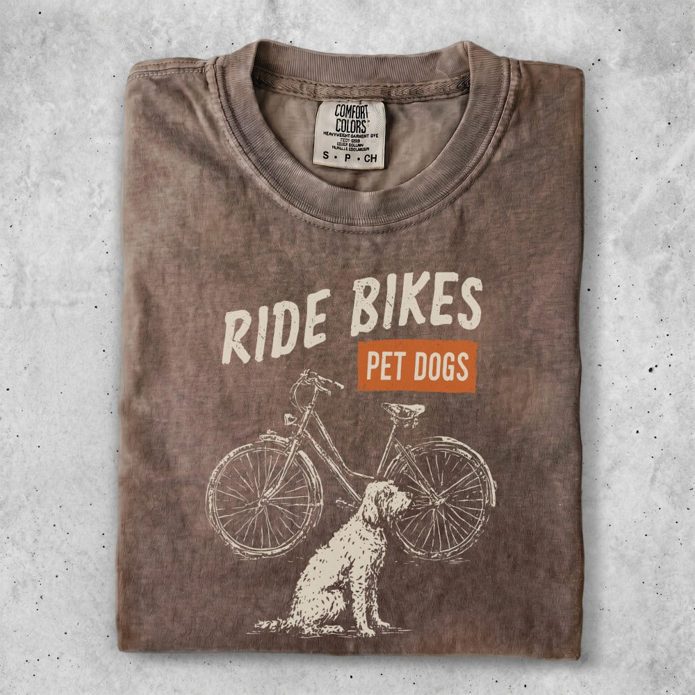 T-shirt with "Ride Bikes Pet Dogs" text and a bicycle and dog graphic.