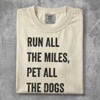 T-shirt with text "Run all the miles, pet all the dogs."