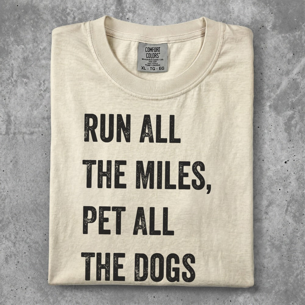 T-shirt with text "Run all the miles, pet all the dogs."