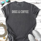 Dark gray t-shirt with white text "DOGS & COFFEE".