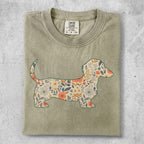 T-shirt with a silhouette of a dachshund filled with a floral pattern.