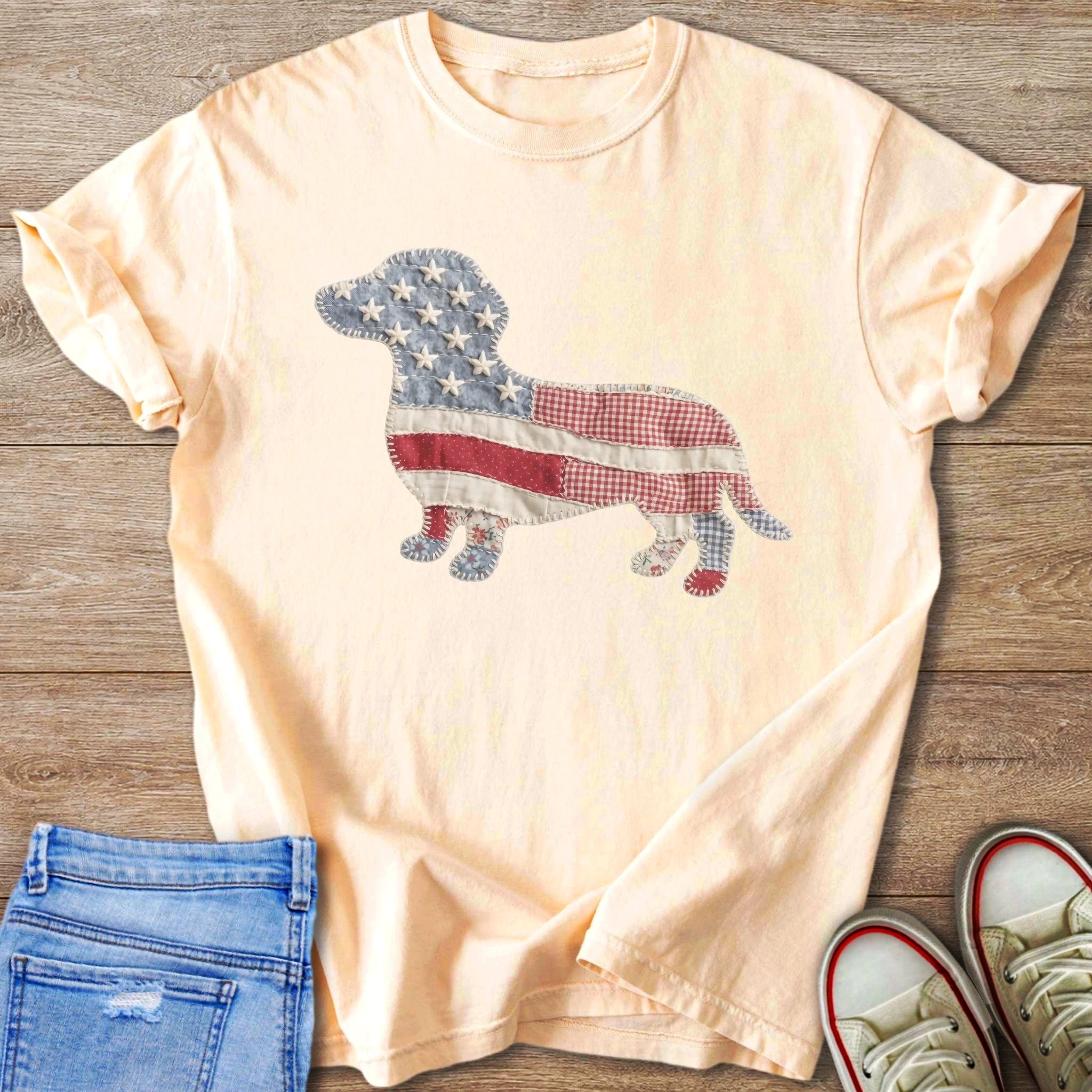 Peach t-shirt with a dachshund silhouette made of American flag patchwork.