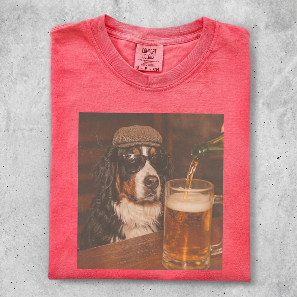 Bernese Mountain Dog wearing sunglasses and a cap, holding a beer.