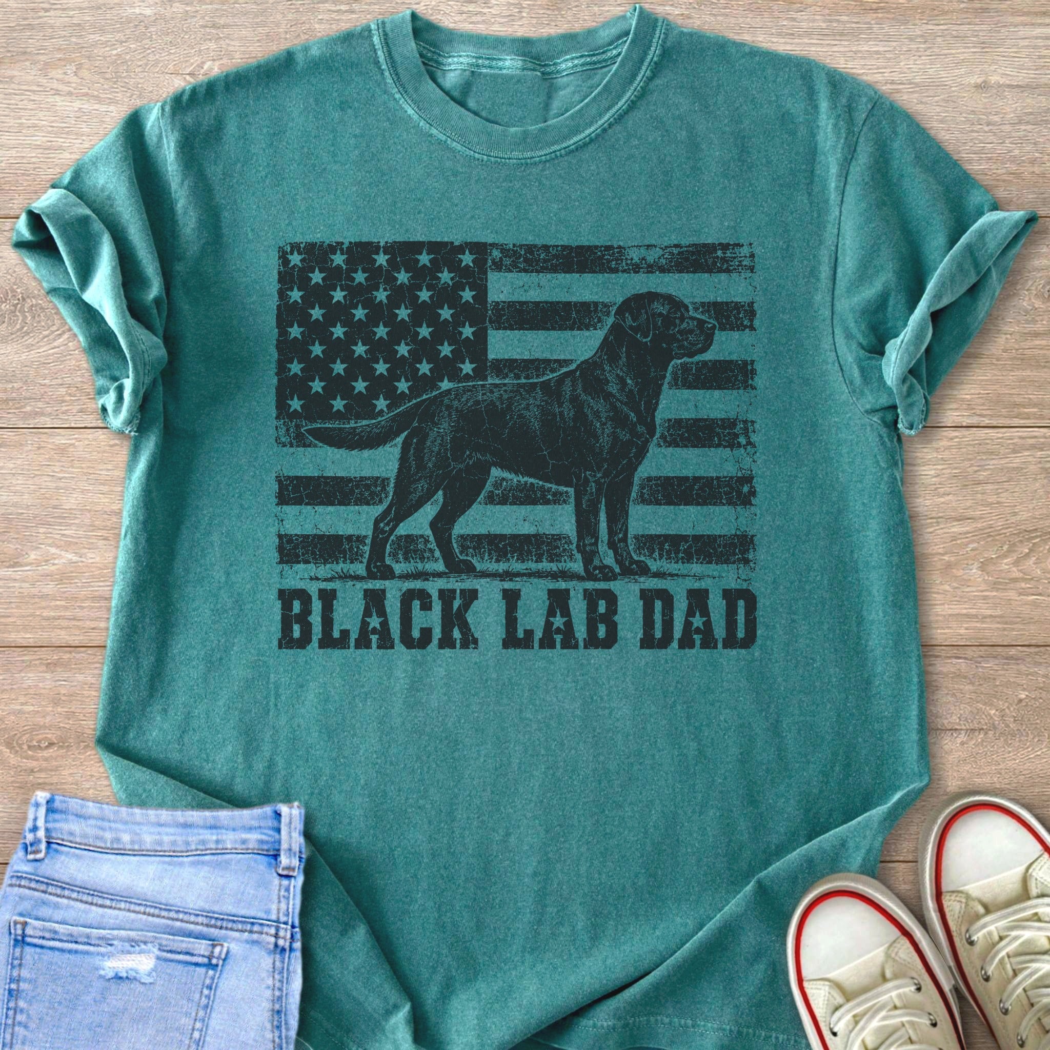 Green t-shirt with black distressed American flag and black lab graphic and text.