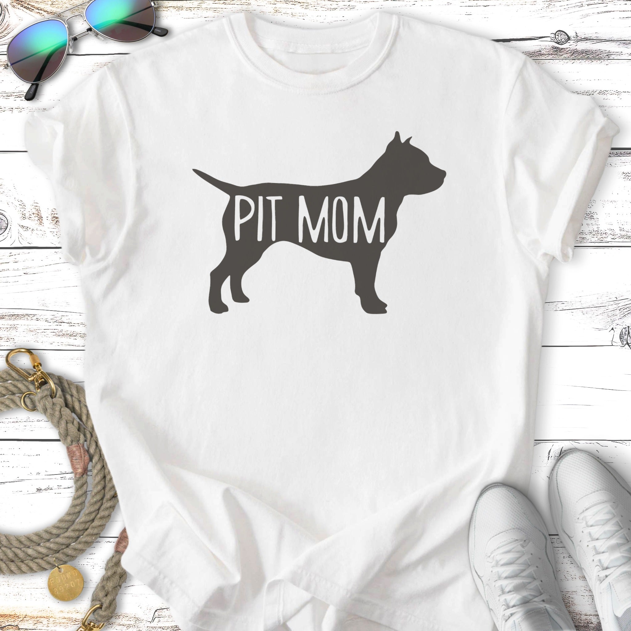 White t-shirt with "PIT MOM" text inside a silhouette of a dog.
