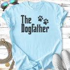Light blue t-shirt with black text "The Dogfather" and paw prints.
