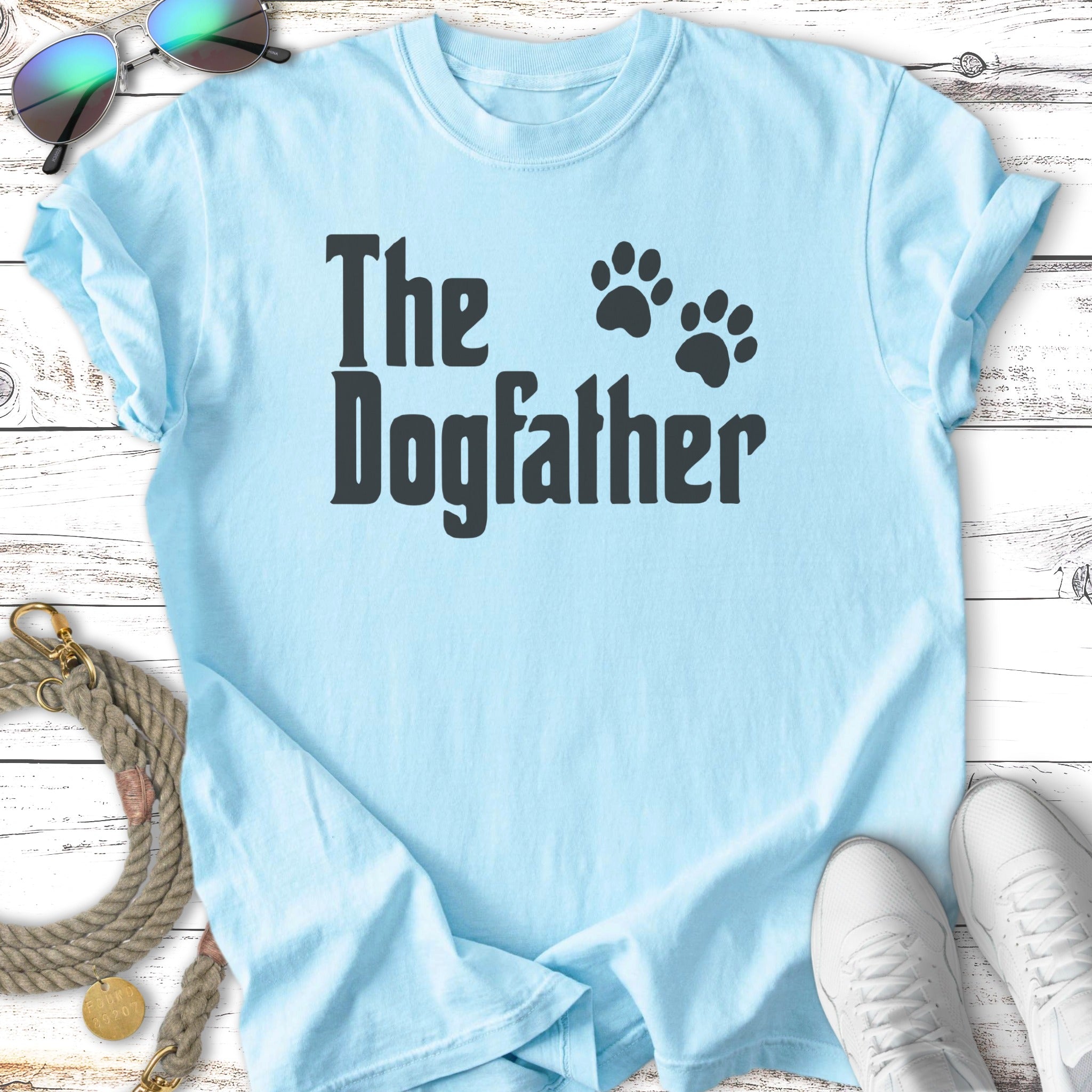 Light blue t-shirt with black text "The Dogfather" and paw prints.