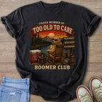 T-shirt with dog in rocking chair reading "Too Old to Care" and "Boomer Club."