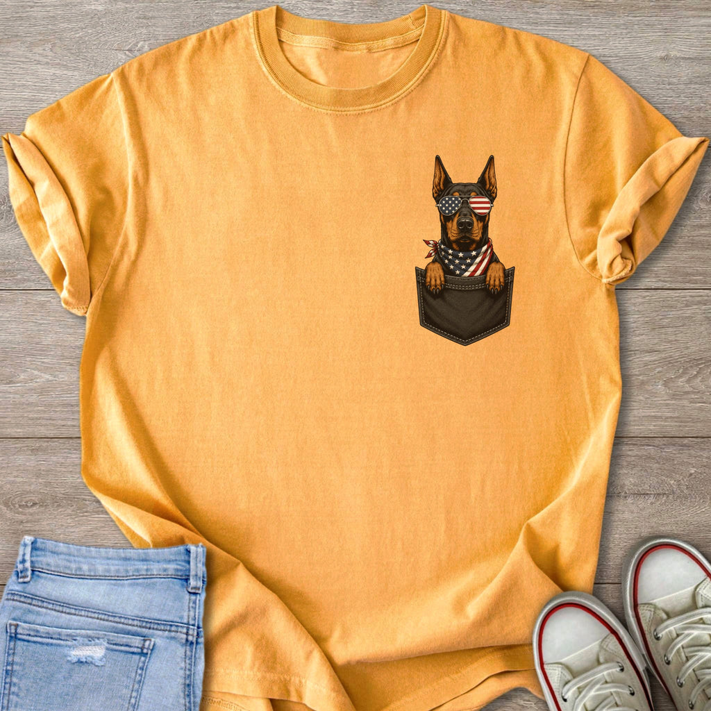 Doberman with American flag sunglasses and bandana in shirt pocket.