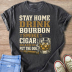 T-shirt text: Stay Home Drink Bourbon Smoke Cigar and Pet the Dog.