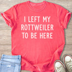 Coral t-shirt with white text "I LEFT MY ROTTWEILER TO BE HERE".