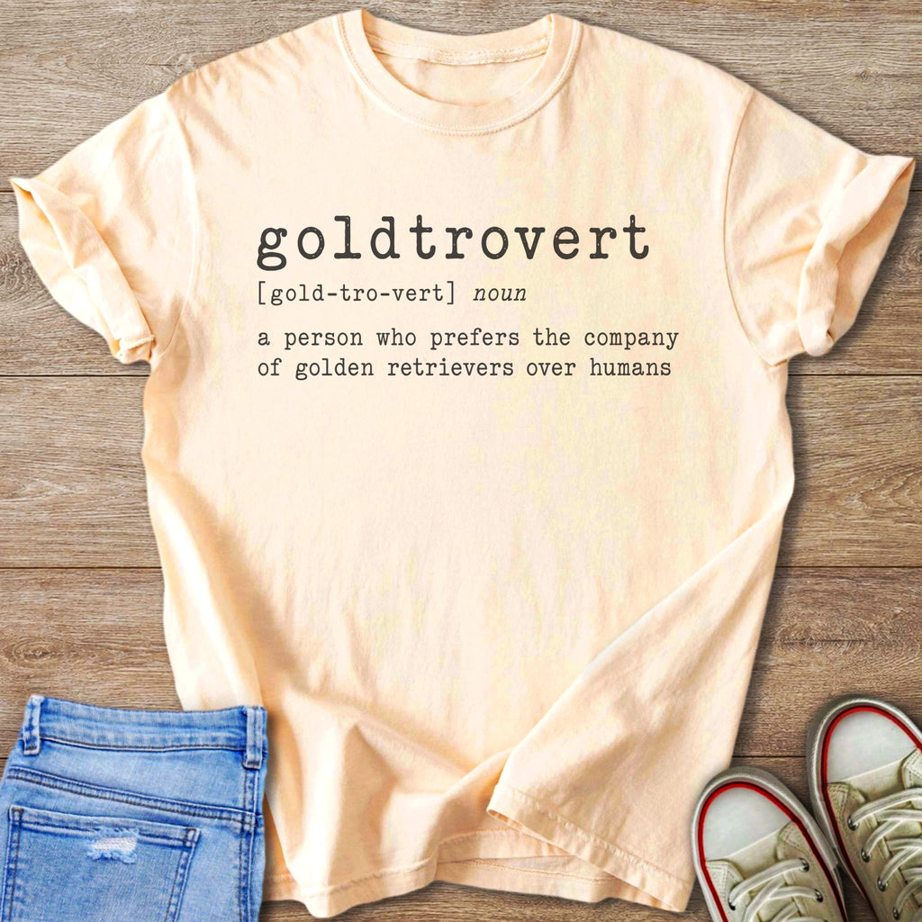 Peach t-shirt with "goldtrovert" definition print: prefers golden retrievers over humans.