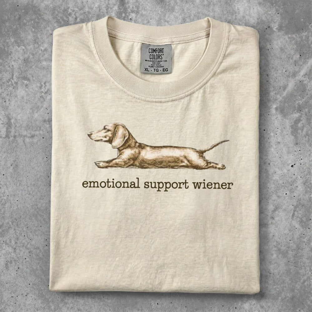 Cream t-shirt with "emotional support wiener" and a dachshund graphic.