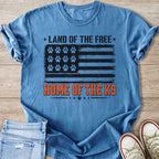 Blue t-shirt with distressed American flag and paw prints, with text "Land of the Free Home of the K9".