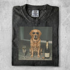Dog wearing sunglasses sitting next to champagne bottle and glass.