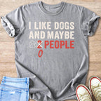 Gray t-shirt with "I Like Dogs and Maybe 2 People" text and paw print.