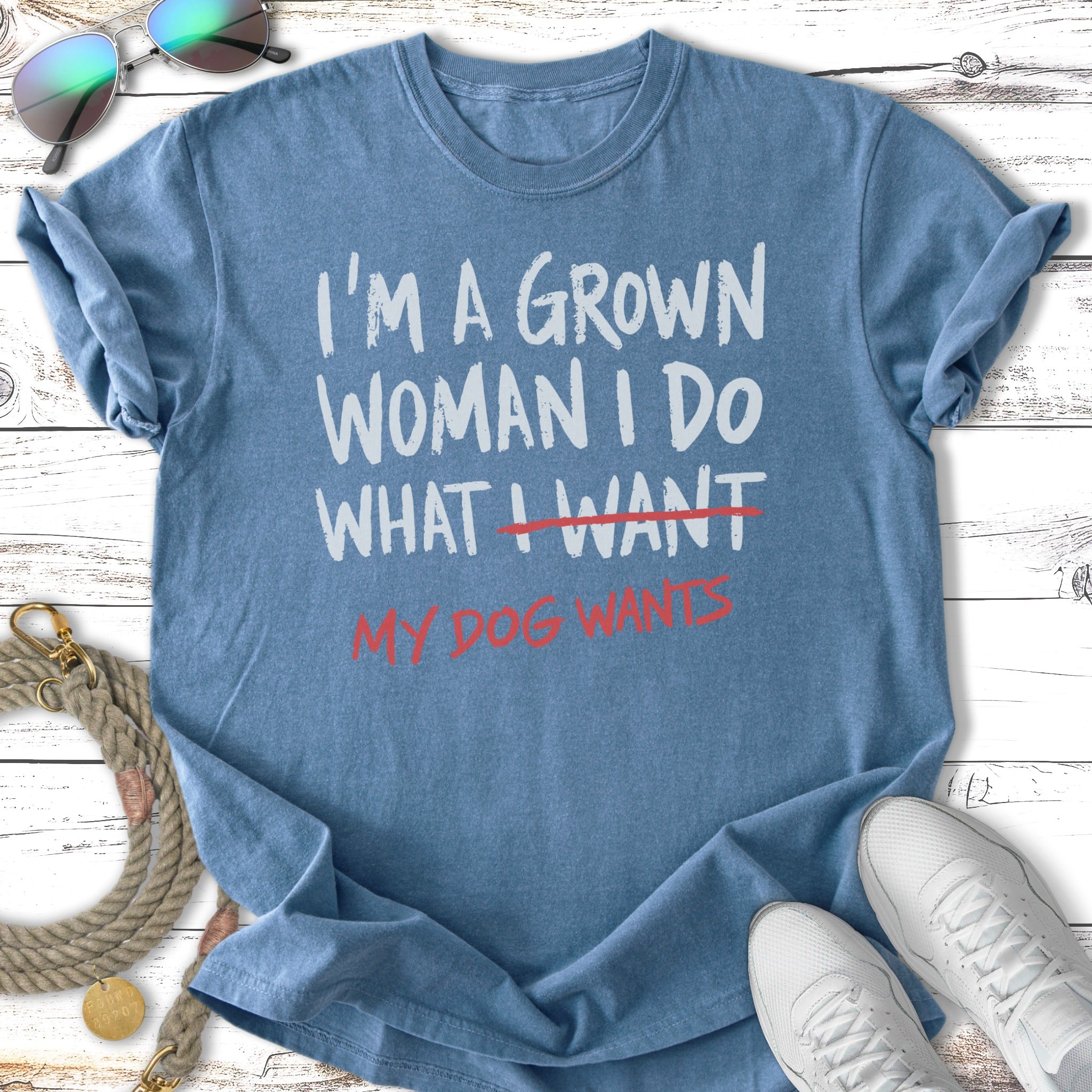 Blue t-shirt with "I'M A GROWN WOMAN I DO WHAT I WANT MY DOG WANTS" text.