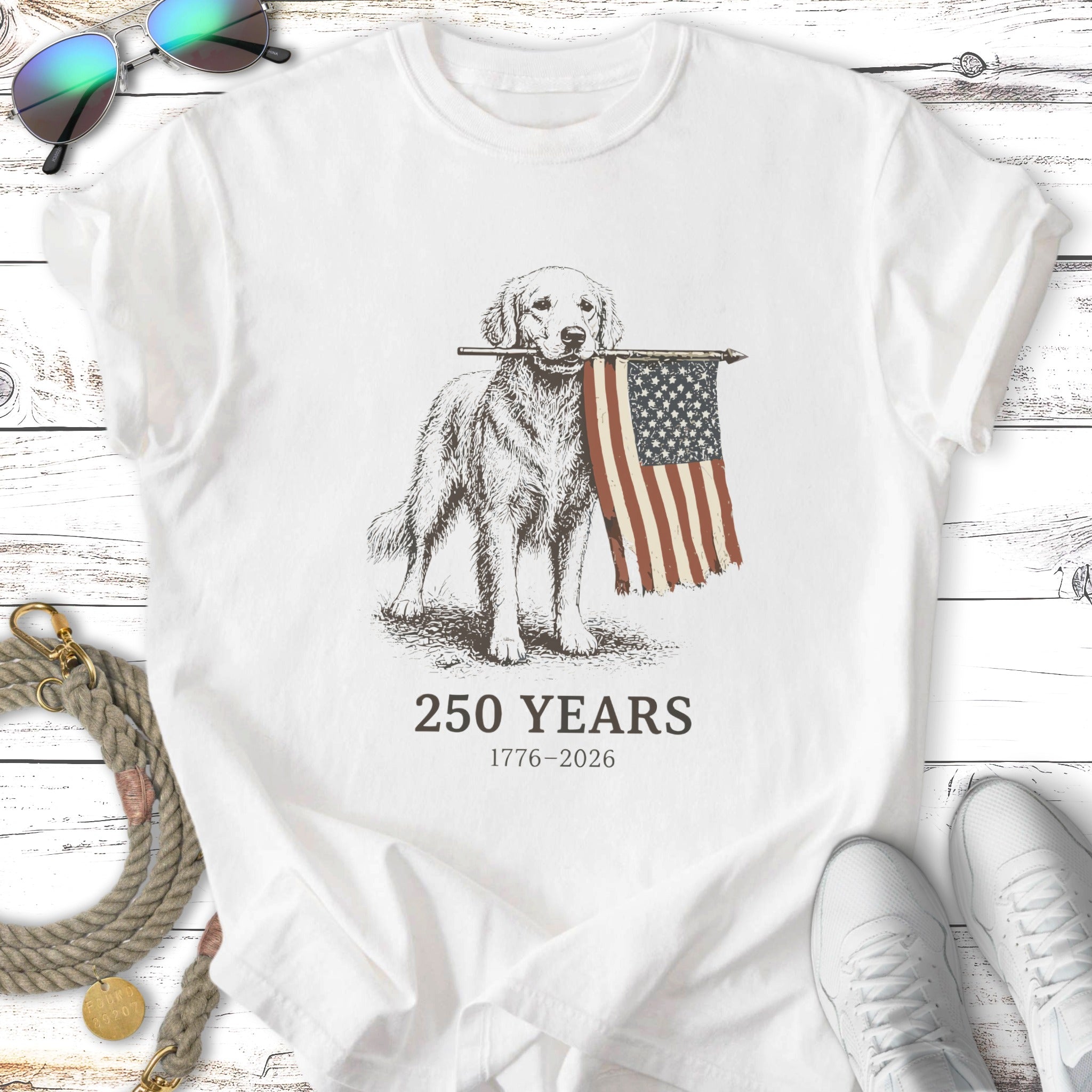 Golden retriever holding American flag, 250 years 1776-2026 text.