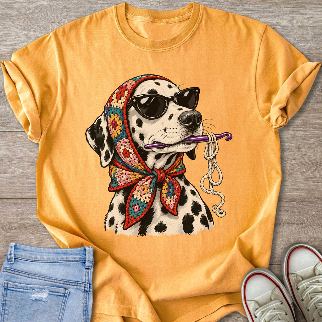 Dalmatian dog wearing sunglasses and a colorful scarf, holding crochet hook and yarn.
