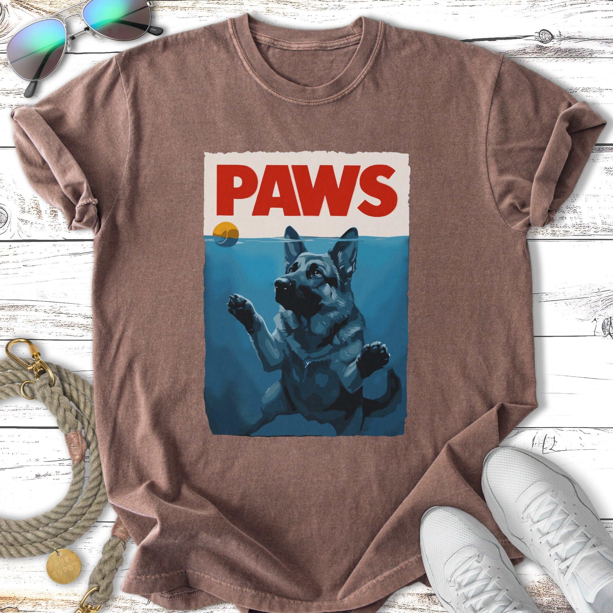 German Shepherd underwater reaching for "PAWS" text.