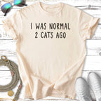 Cream t-shirt with text "I WAS NORMAL 2 CATS AGO".