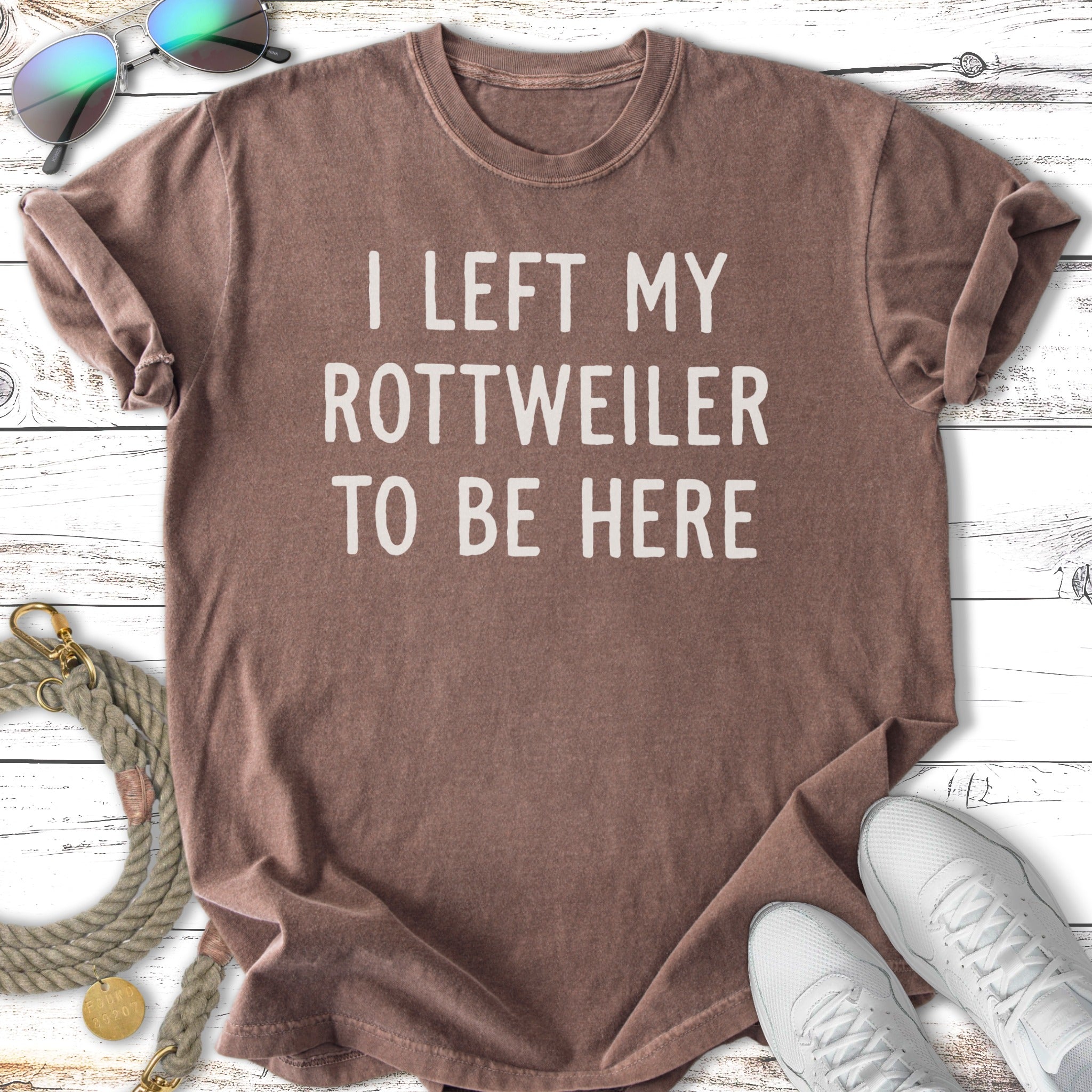 Brown t-shirt with white text: "I LEFT MY ROTTWEILER TO BE HERE."