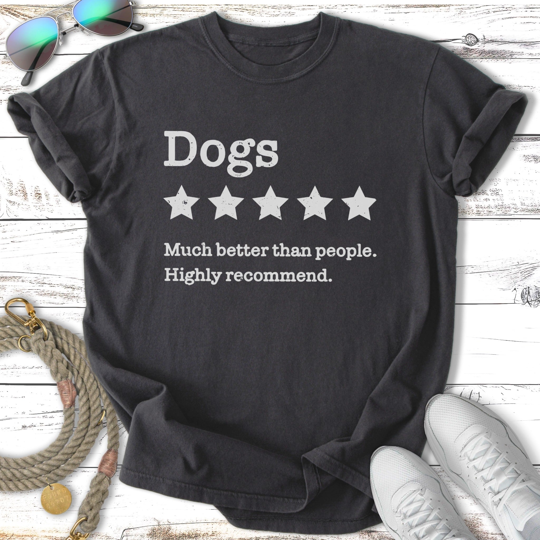 Dark t-shirt with "Dogs" and five stars, "Much better than people. Highly recommend."