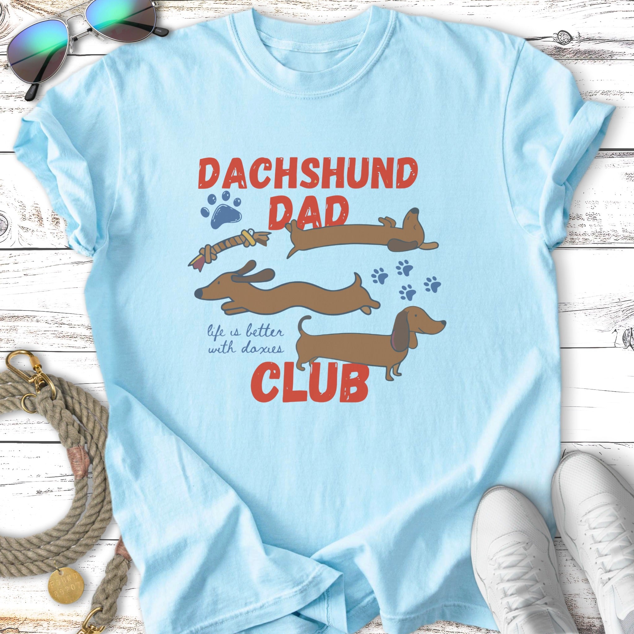 Light blue t-shirt with "Dachshund Dad Club" and dachshund illustrations.