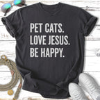 Dark t-shirt with text "Pet Cats. Love Jesus. Be Happy."