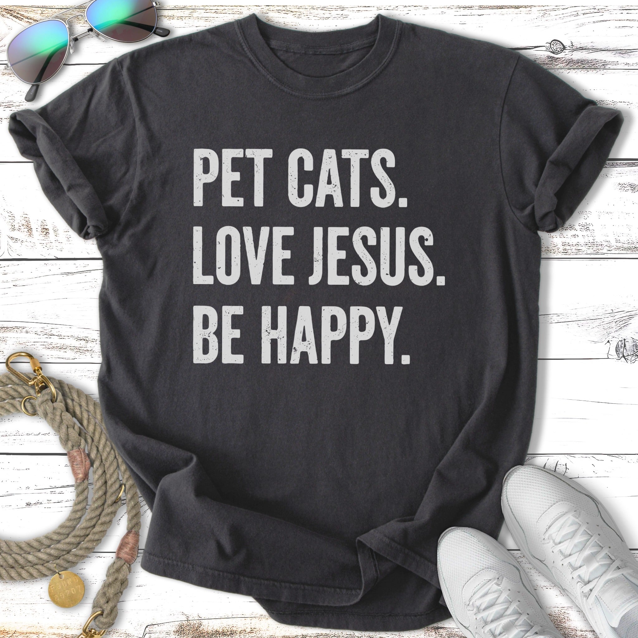 Dark t-shirt with text "Pet Cats. Love Jesus. Be Happy."