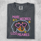 T-shirt with dachshund wearing heart sunglasses and "More Weenies Less Meanies" text.