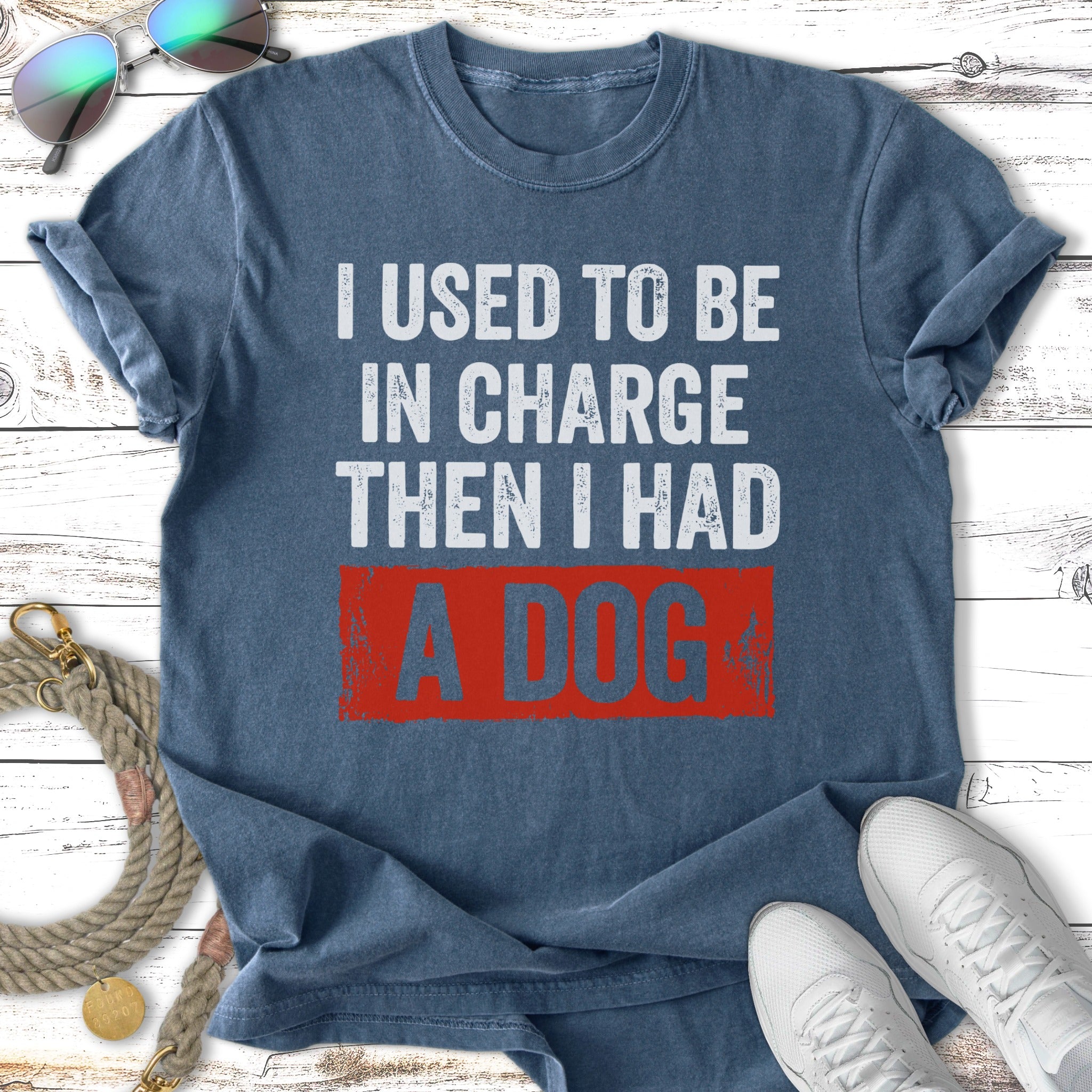 Navy t-shirt with "I used to be in charge, then I had a dog" text.
