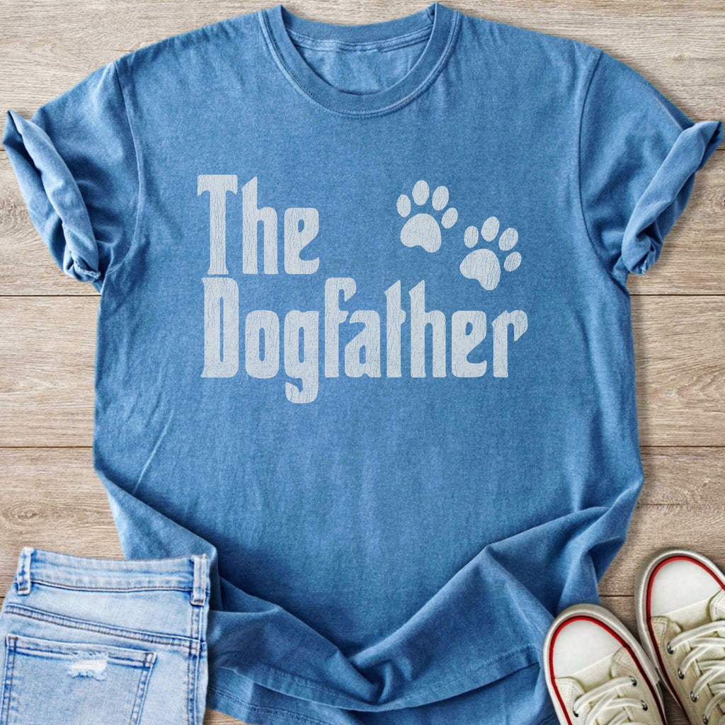 Blue t-shirt with "The Dogfather" written in white, accompanied by paw prints.