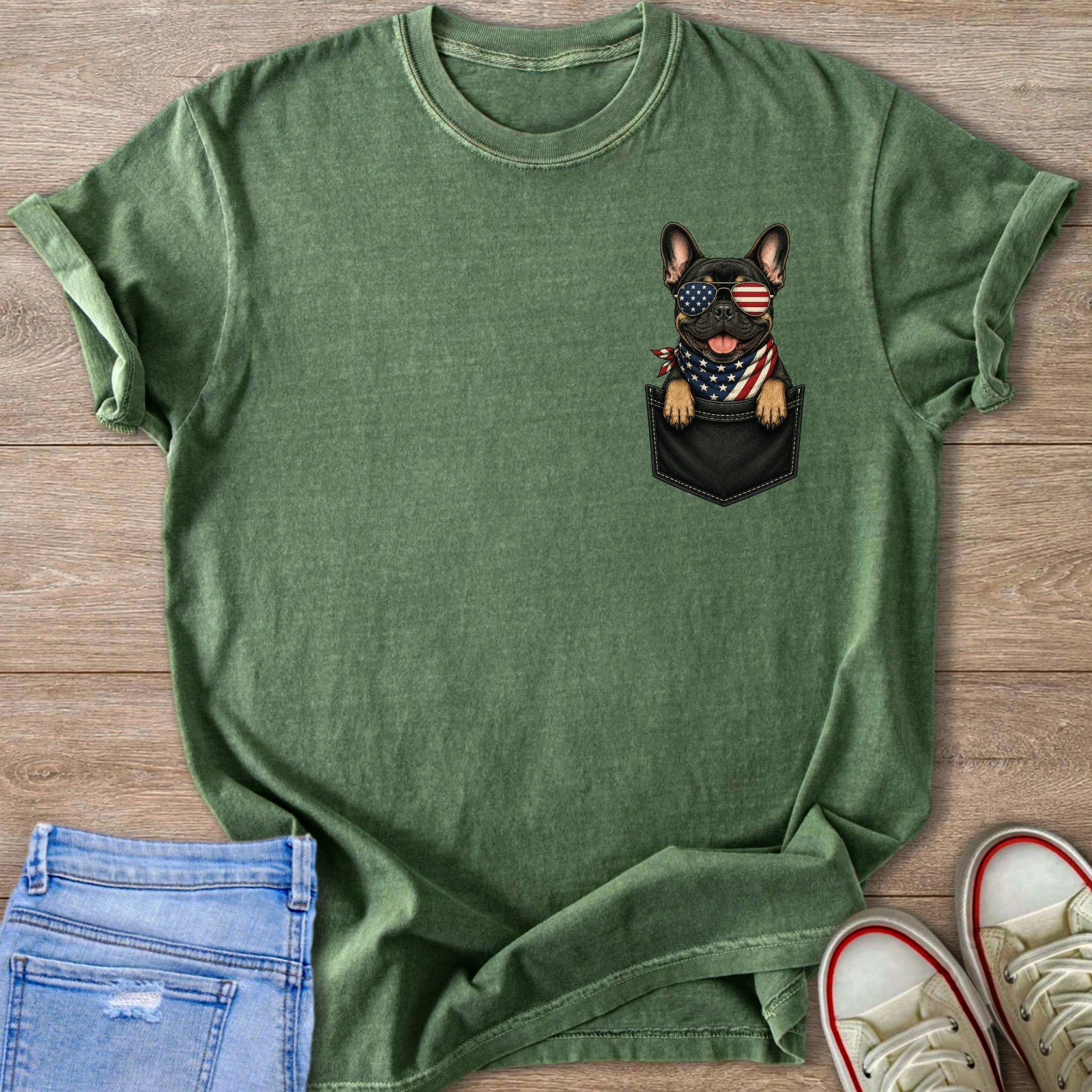 Green t-shirt with a French bulldog wearing American flag sunglasses and bandana peeking from pocket.